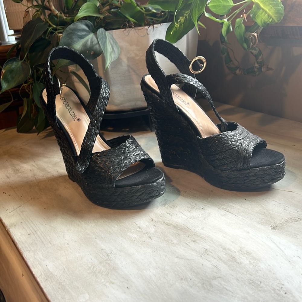 Black 7.5 open toe wedge sandals. New without tags.